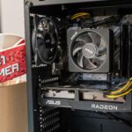 Close-up of gaming computer interior with cooling fan and graphics card.